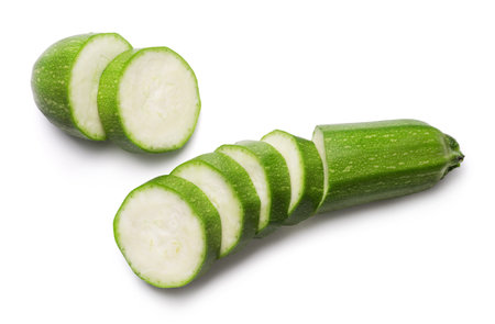 Fresh green zucchini and zucchini slices isolated on white background. Fresh vegetables.の写真素材