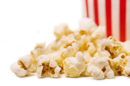 Popcorn isolated. Popcorn flakes macro on a white background close-up.の写真素材