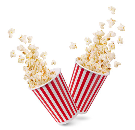 Two striped buckets with popcorn flakes isolated on a white background.の写真素材