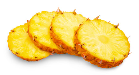 Pineapple isolated. Ripe Kenyan pineapple cut into round slices on a white background.の写真素材