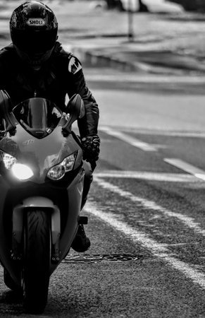 Motorcycle biker on the road. black and white photo.
