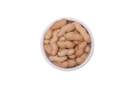 Peanuts in a white cup on a white background
