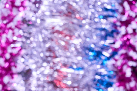 Blurred christmas lights background. De focused Light