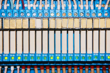 Many electrical wires connected to the numbered relays.の写真素材