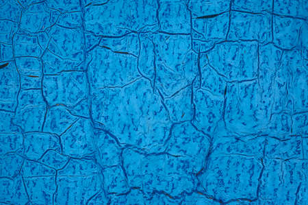 The old blue sheet of iron is covered with cracks. Abstract background. Grunge background.の写真素材