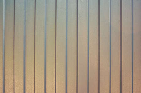 Sheet iron in a vertical strip. Abstract background. Metallic background.