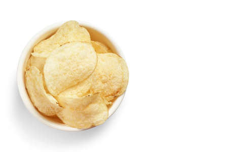 Delicious golden potato chips in a white bowl isolated on white background. Food background.