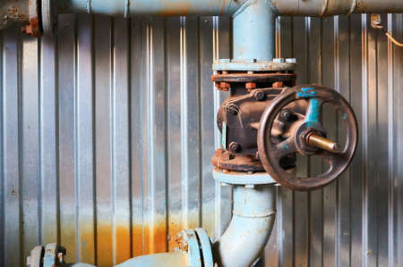 Old valves on the cold water pipeline. Industrial background.の写真素材