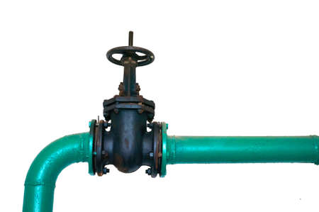 Old black valve on a cold water pipeline painted green isolated on a white background. Industrial...