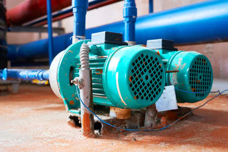 Blue engine with a pump connected to the pipes blue.