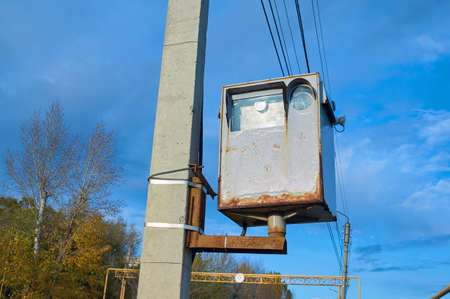 The old road rust camera surveillance for cars fixed to a concrete pillar.