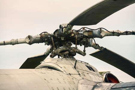 The propeller of the helicopter close-up against a gray sky. Color toning.の写真素材