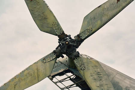 The propeller of the helicopter close-up against a gray sky. Color toning.の写真素材
