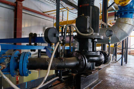 Engine with the pump and the pressure gauge on the pipeline.