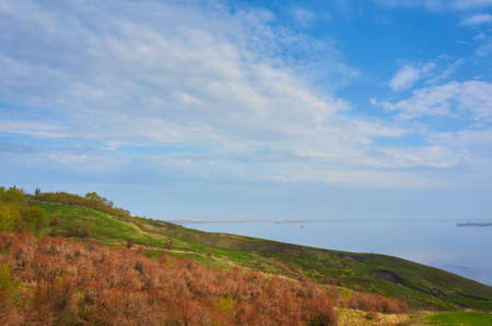 Mountain Beach in the fall against the blue sky with clouds.