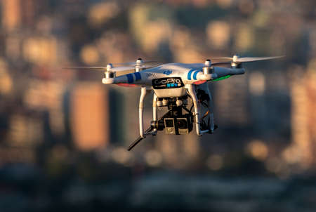 TIRANA, ALBANIA: White Drone flying over the cityのeditorial素材