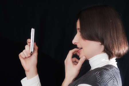 the girl with a mobile phoneの写真素材