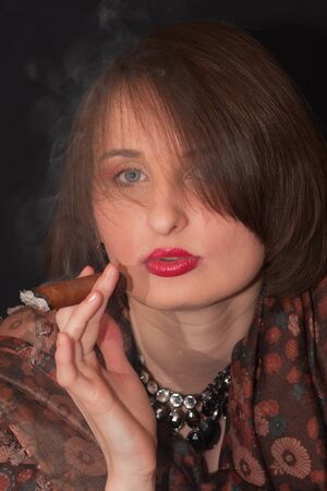 the girl with a cigarの写真素材