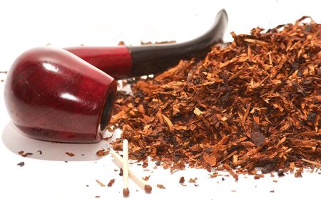 Red pipe lying on tobacco