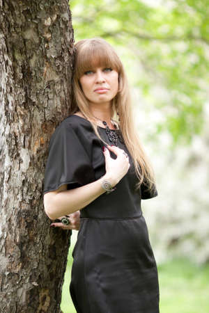 The girl near a treeの写真素材