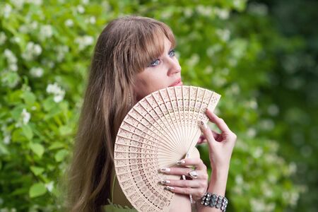 Girl s face and fanの写真素材