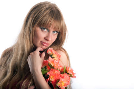 The woman with a bouquet of red colorsの写真素材