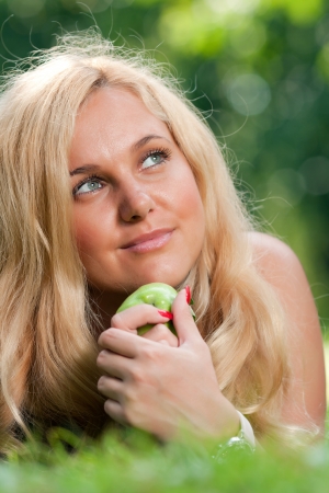 Woman s face and appleの写真素材