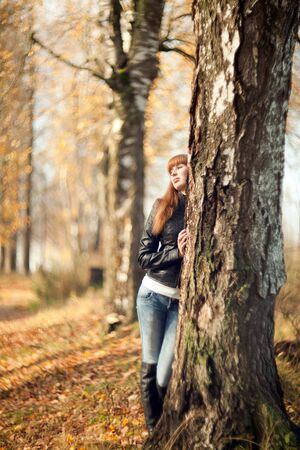 woman in the autumn parkの写真素材