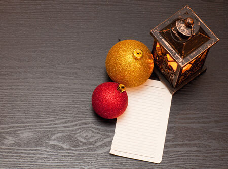 note on a wooden table lamp pressed and Christmas decorationsの写真素材