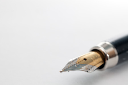 Fountain pen close-up on white. Photo closeup Pen