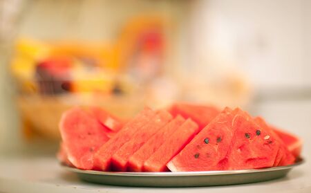 Red sliced watermelon lying on a trayの写真素材