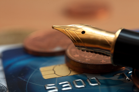 Beautiful fountain pen closeup and coins.Photo closeup Penの写真素材