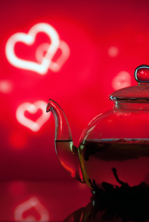 Teapot from a glass on a bright background with bokehの写真素材