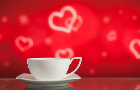 White tea cup on the bright blurred background with bokehの写真素材