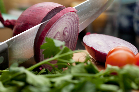 Cut purple onion on the table close-upの写真素材