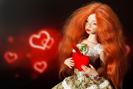 Red-haired doll and heart on a beautiful background
の写真素材