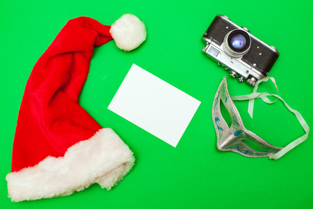 Old retro camera and photo on green backgroundの写真素材