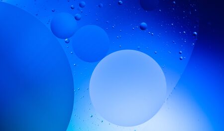 Abstract blue background with beautiful bubbles. Oil on the water.
