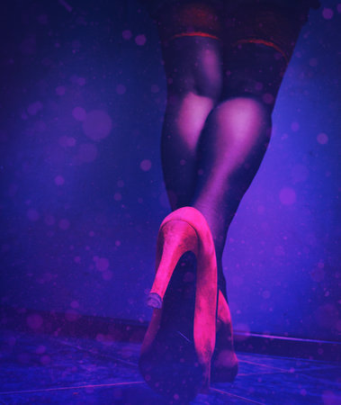 beautiful female legs in red high-heeled shoes and stockingsの写真素材