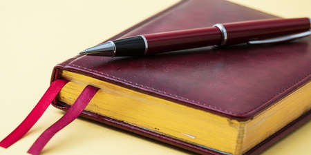 ballpoint pen lies on a notebook close-upの写真素材