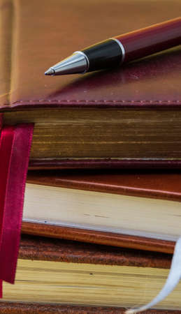 ballpoint pen lies on a notebook close-up