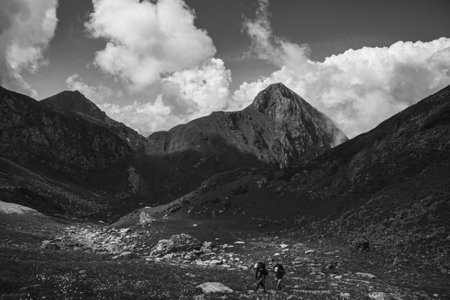 tourists in a beautiful mountain valley on a summer dayの写真素材