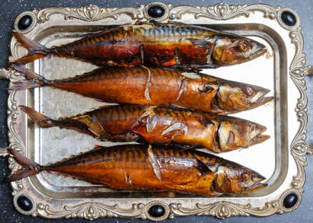 smoked beautiful mackerel on a tray close-upの写真素材