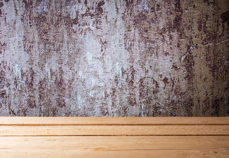 wooden table made of boards near an old shabby wall