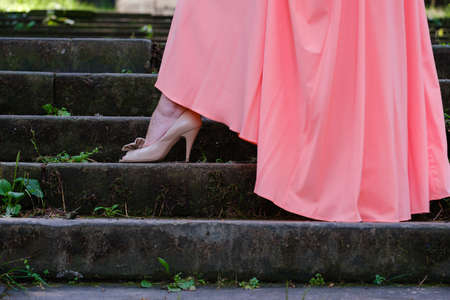 beautiful shoe on a woman's leg on the stepの写真素材