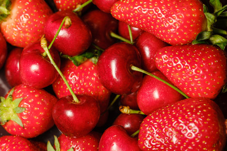 beautiful red ripe strawberries and cherries close-up