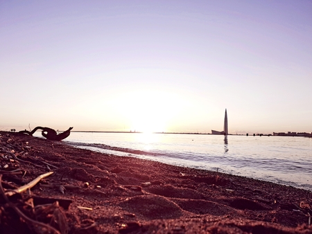 Rays of sunset on the water surfaceの写真素材