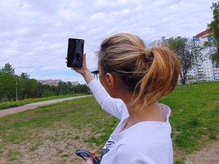 Girl making selfie on cameraの写真素材