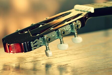 Detail of Burgundy, wooden guitars. Detail of the Spanish guitar. Picture of the music, string instrument.の写真素材