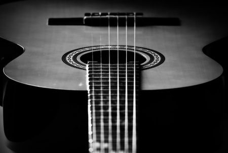 Detail of Burgundy, wooden guitars. Detail of the Spanish guitar. Picture of the music, string instrument.の写真素材